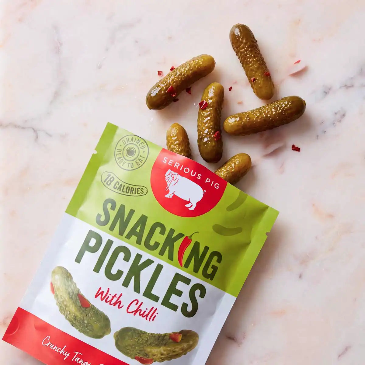 serious pig snacking pickles
