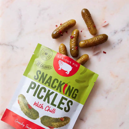 serious pig snacking pickles