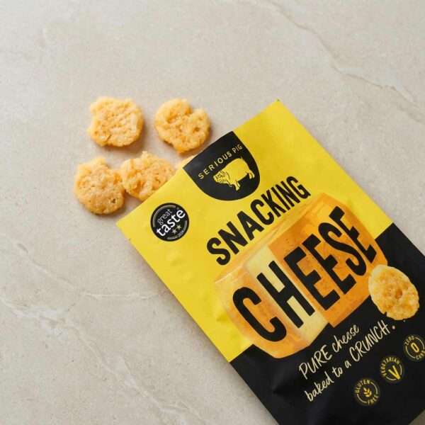 serious pig snacking cheese